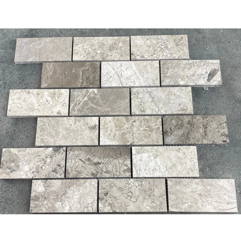 Silver Shadow Marble 2"x4" Brick Honed on 12" x 12" Mesh Mosaic Tile SKU-HSSH2x4BMOSH under sunlight