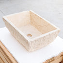 troia light beige rustic natural stone Vessel Sink honed and hand chiseled size W12 L17 H6 SKU NTRSTC54 angle view