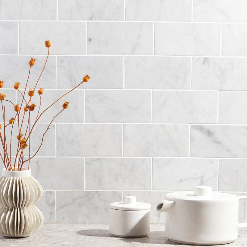carrara white marble tile size 3"x6"x3/8" (7.5cmx15cm) surface polished edge beveled SKU-10086379 installed on kitchen wall 